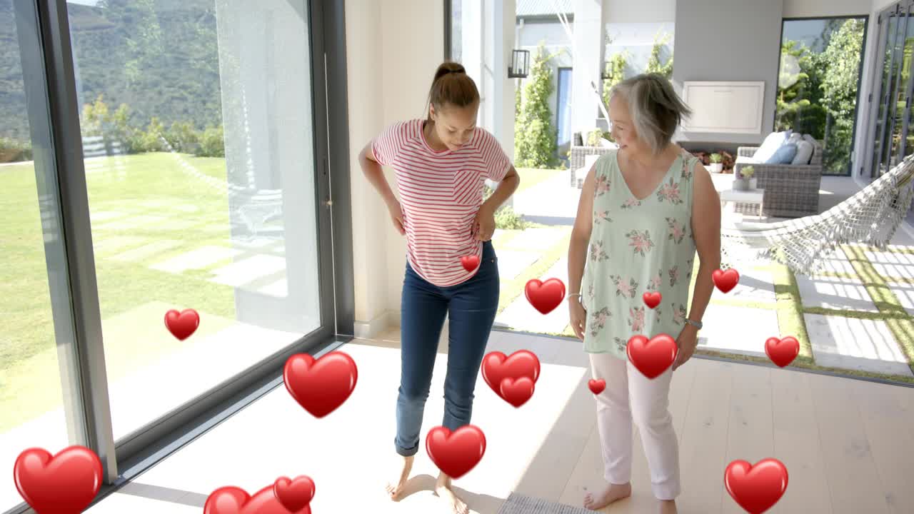Mother-daughter standing by doors heart appearing at feet hearts popping tapping copying for health