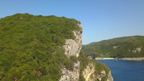 cinematic corfu headland flyover reveals beautiful paleokastitsa beach resort