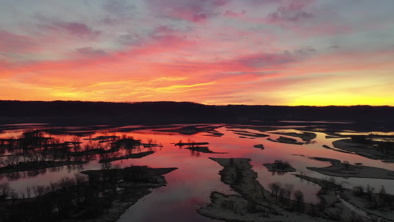Vibrant Sunrise Colors Reflected in a Serene River Landscape