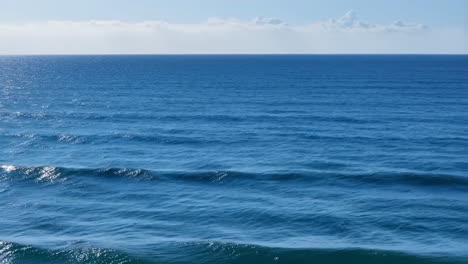 vast blue ocean with gentle waves and horizon