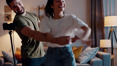 joyful couple vlogging and having fun at home