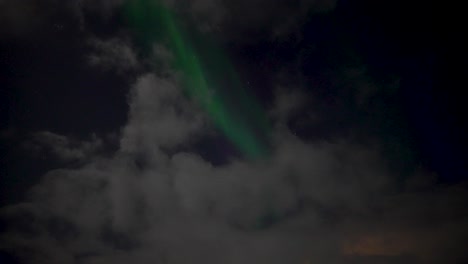 aurora borealis in the clouds as seen in iceland at night
