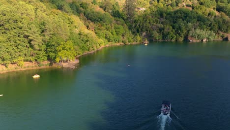 sailing on serene river of minho near belesar village in ribeira sacra, galicia spain