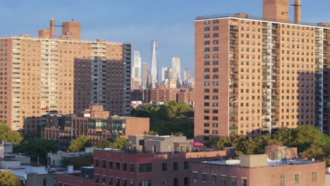 aerial view of the world trade center between two apartment buildings in brooklyn. shot on a summer morning in new york city.
