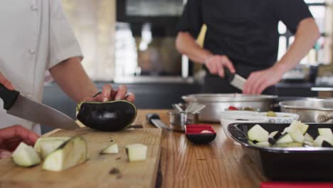 caucasian female chef teaching diverse group