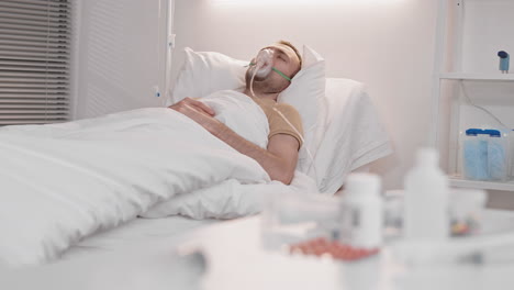 sick man lying in hospital ward