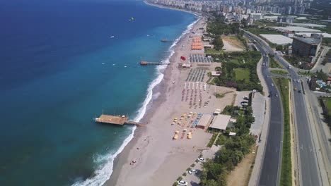 aerial view of a beautiful beach with turquoise water and hotels