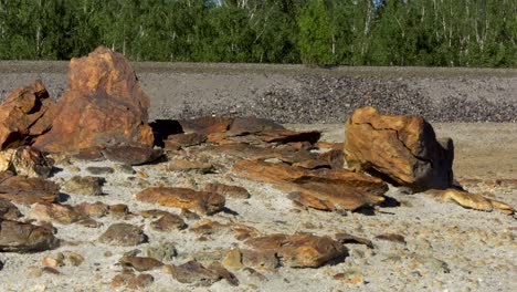 rusty rocks and gravel in a quarry landscape