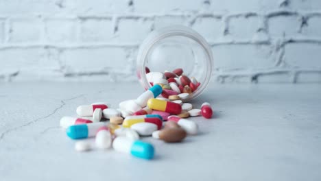 assorted pills and capsules in a container