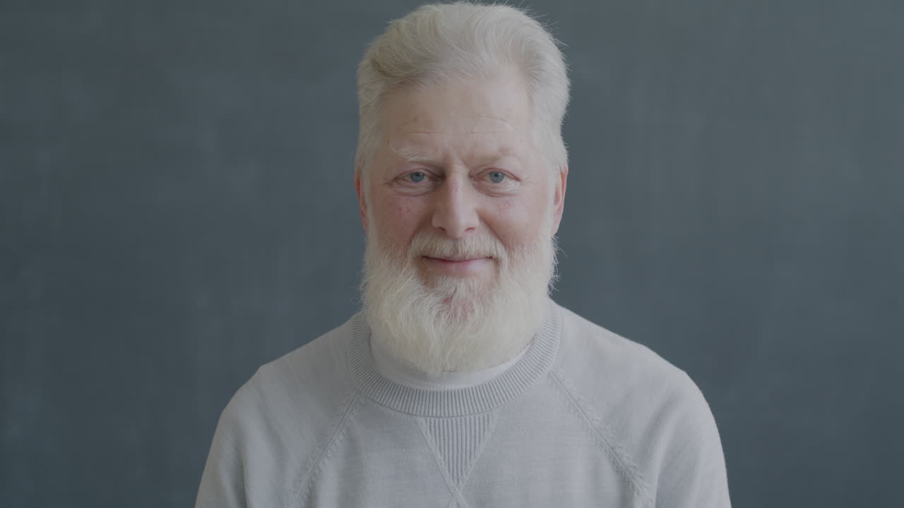Smiling Elderly Man with a Thumbs Up
