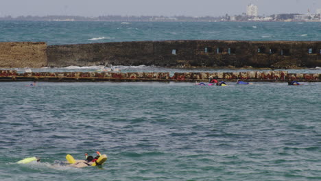 tourist snorkeling in the sea water surface at san juan puerto rico, usa