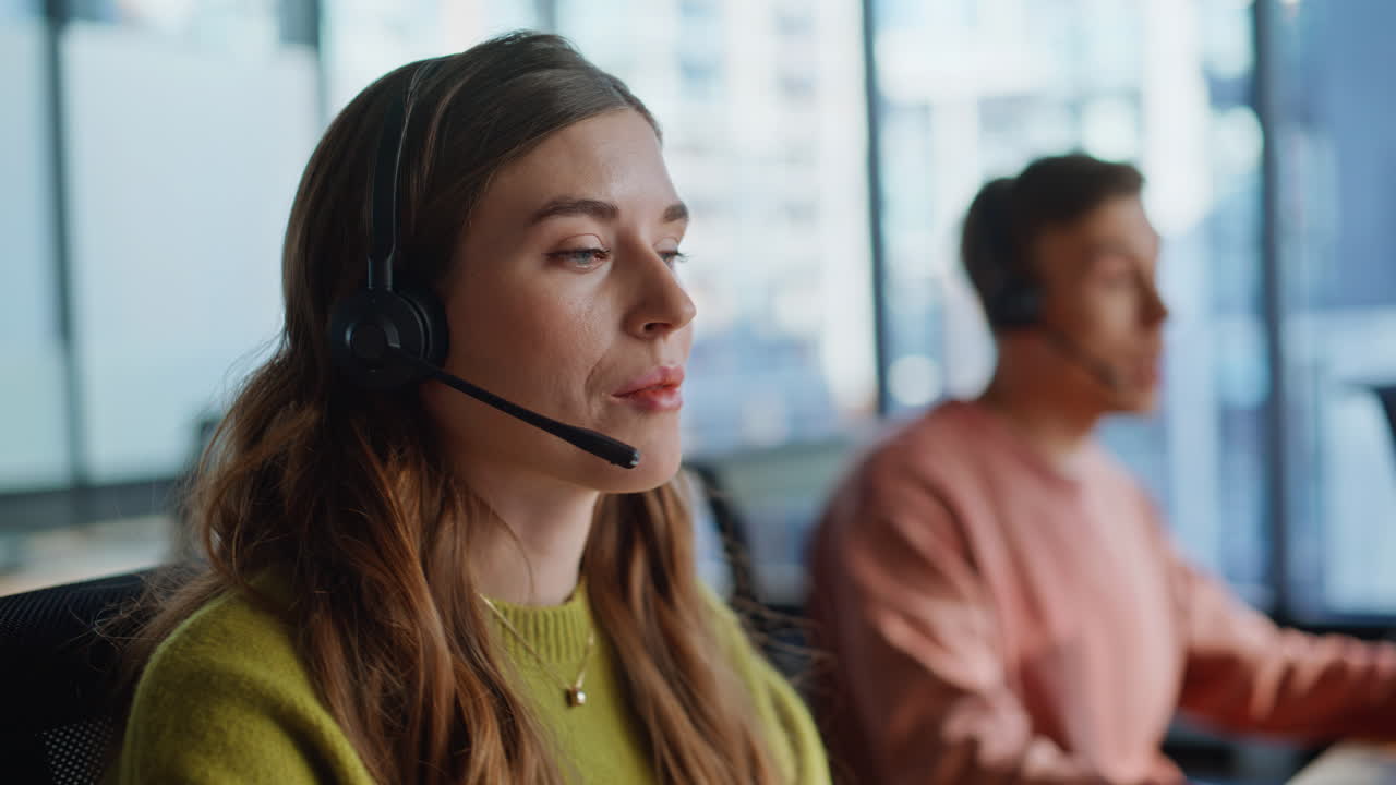 Thoughtful support agent listening customer solving request at workplace closeup