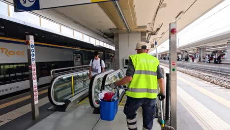 people using escalator at florence train station