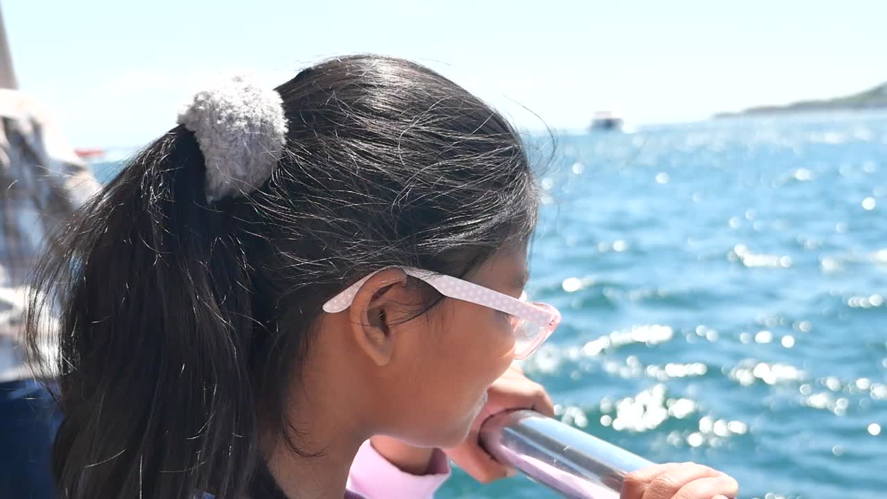 Girl Looking at the Ocean from a Boat