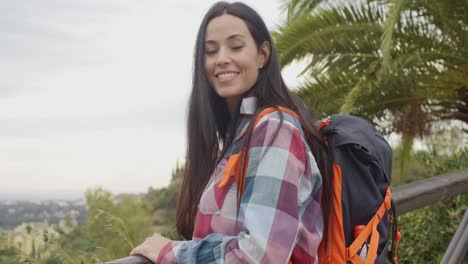 happy friendly woman wearing a backpack