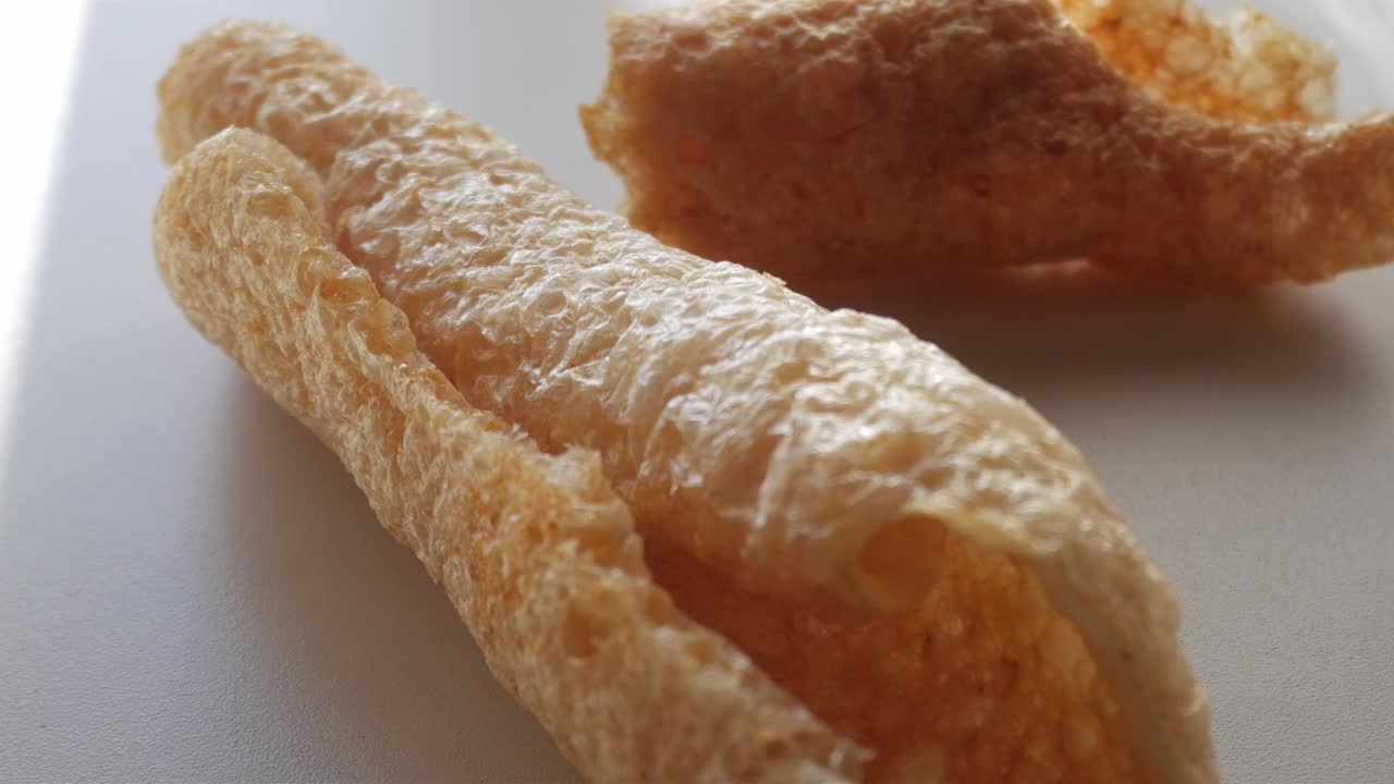 Crispy pork rinds (cortezas) with a light, airy texture close-up shot
