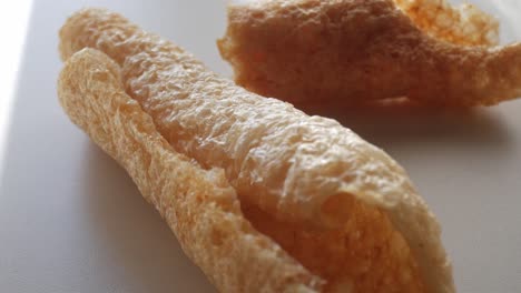 crispy pork rinds (cortezas) with a light, airy texture close-up shot