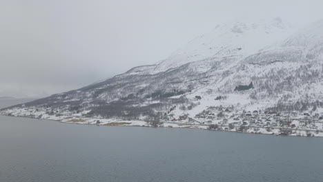 kåfjord town and harbour by the foot of the mountain in olderdalen, norway