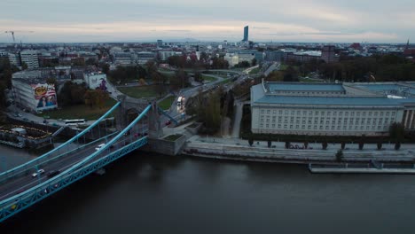 Grunwald-bridge-over-river-Odra-in-Wroclaw-with-busy-traffic-in-the-road