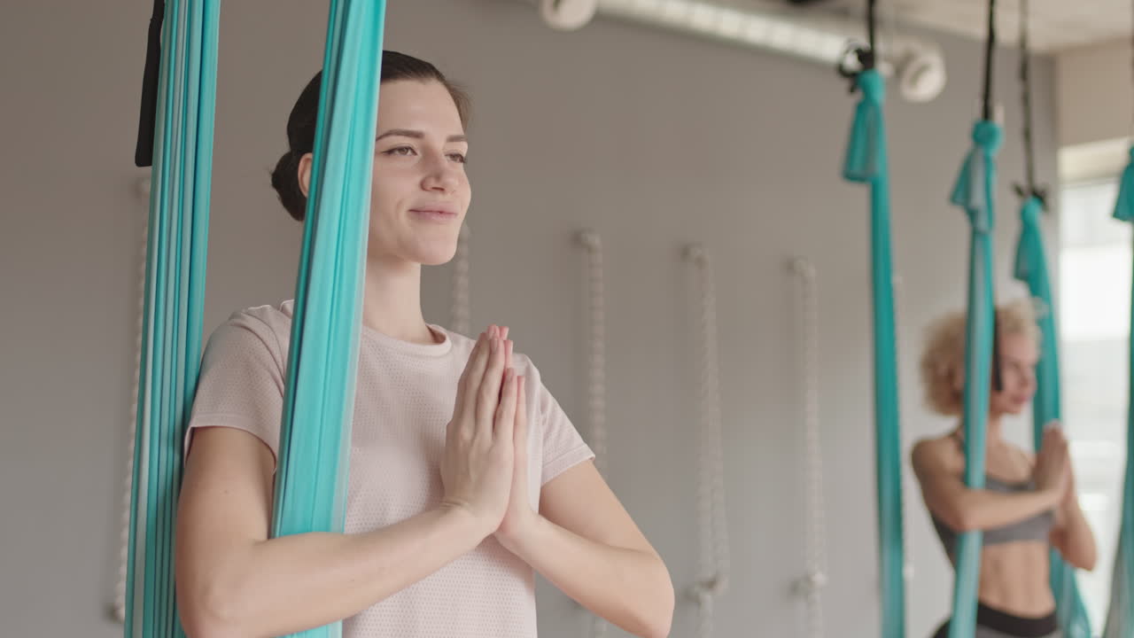Caucasian Woman in Aerial Yoga Class