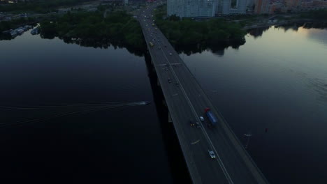 car driving on bridge at evening sunset landscape. aerial landscape evening city