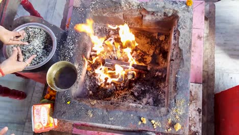 hindu-holy-rituals-with-fire-from-top-angle-at-day-video-is-taken-mahavir-temple-patna-bihar-india-on-Apr-15-2022