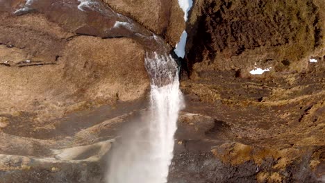 Drone-shot-of-a-waterfall-in-Iceland