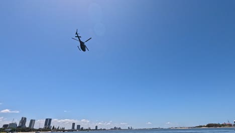 helicopter flying over gold coast marina waters