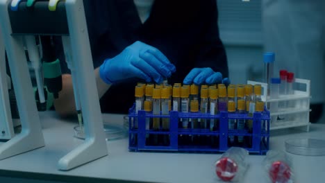 scientist handling blood samples in a laboratory