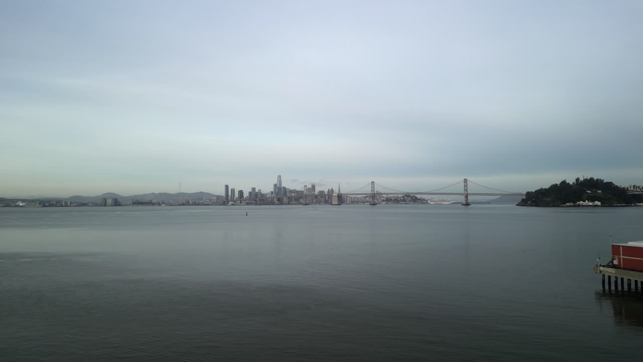 Drone views provide an expansive look at the Port of Oakland’s shipping channels and dockside activity, along with the San Francisco Bay Bridge in the background.