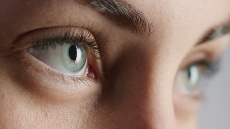 close up blue eyes blinking beautiful natural color healthy eyesight concept