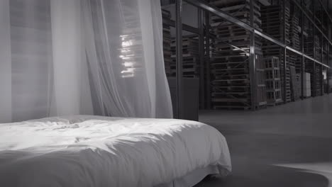 surreal bed in an industrial warehouse