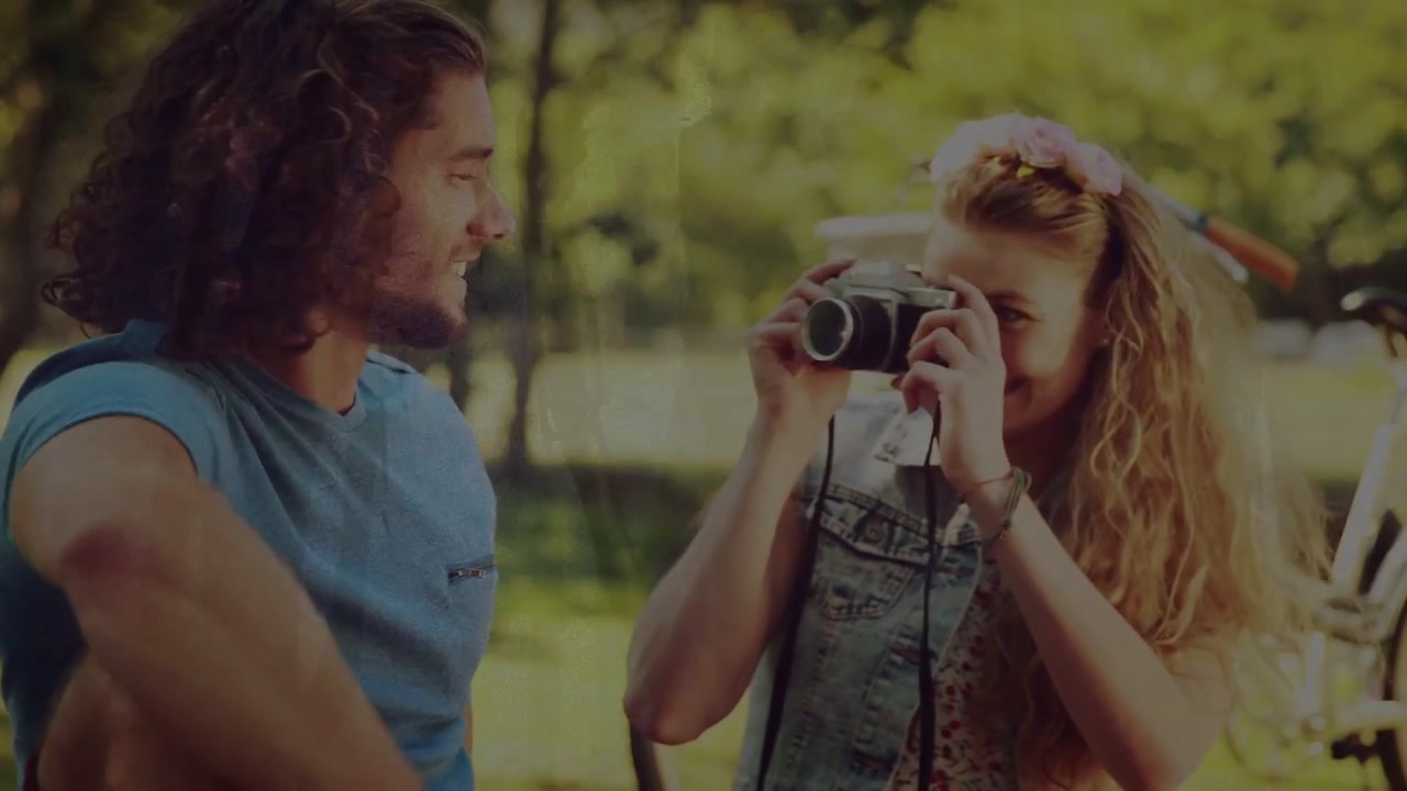 Woman raising film camera, taking shots for memory, man smiling with photography overlays appearing
