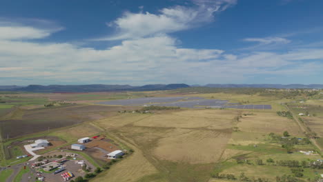 Wide-Angle-Drone-Flyover-Solar-Farm-In-Country-Rural-Australia,-4K-Aerial