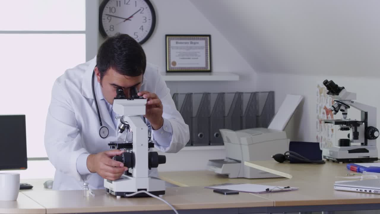 Vet using a microscope in office