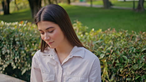 contemplative tourist looking nature sitting park bench closeup. relaxed woman