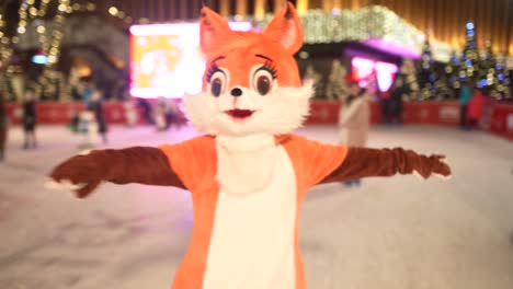 fox mascot at an ice skating rink during the holidays