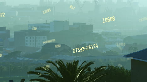 animation of multiple changing numbers against aerial view of cityscape