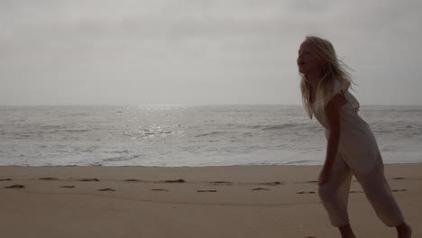 happy girl playing on the beach