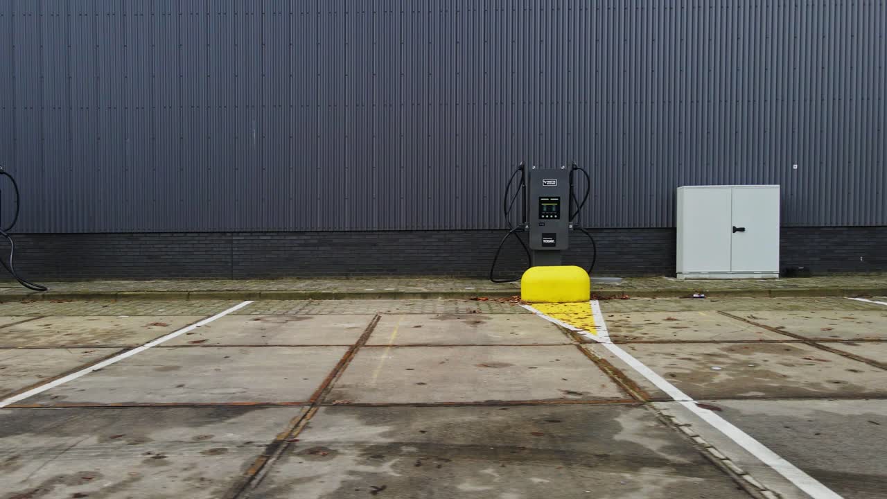Dolly of several electric vehicle charging stations in a row on a parking lot