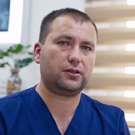 portrait of medical specialist talking on camera. doctor giving a consultation into distance video chat. therapist in medical center speaking online.