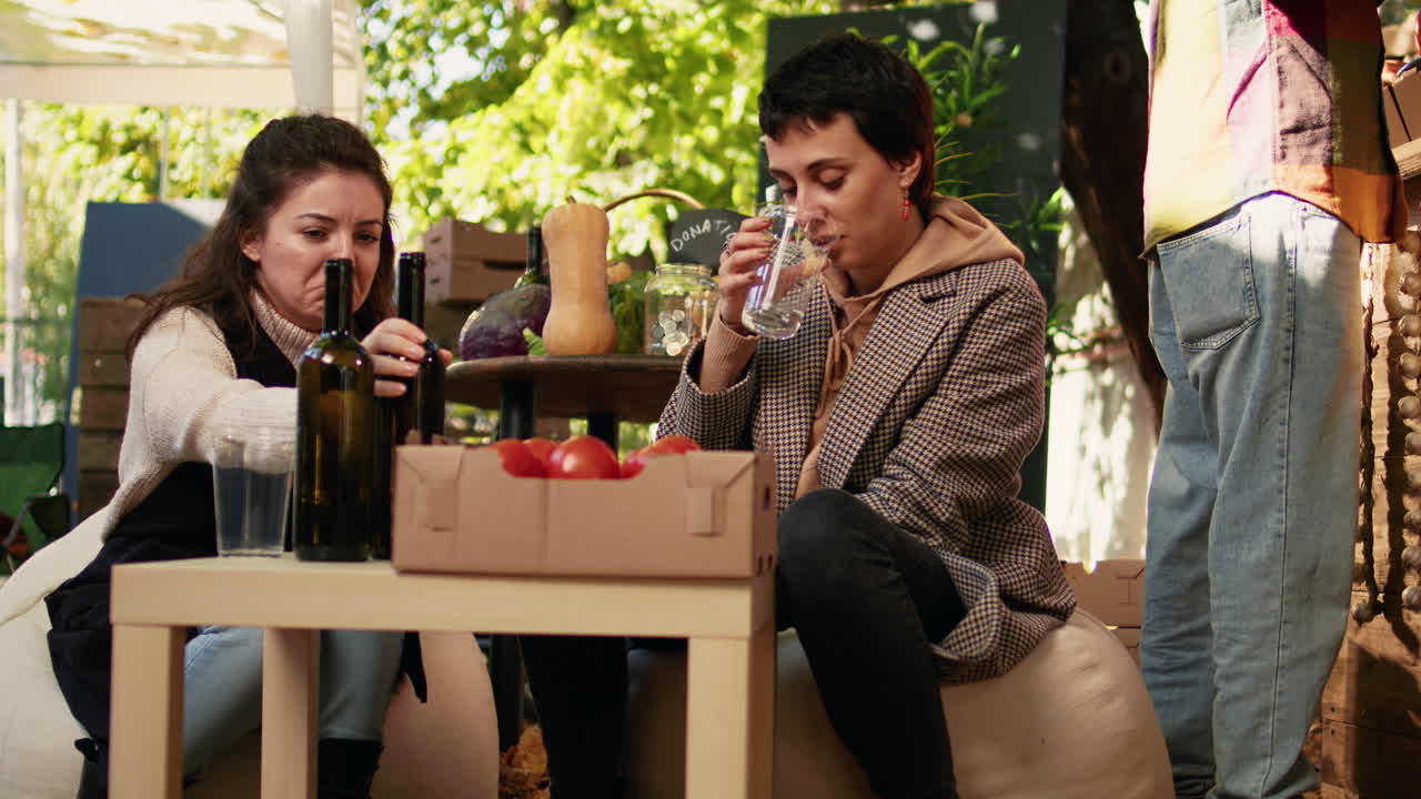 People enjoying wine and vegetables