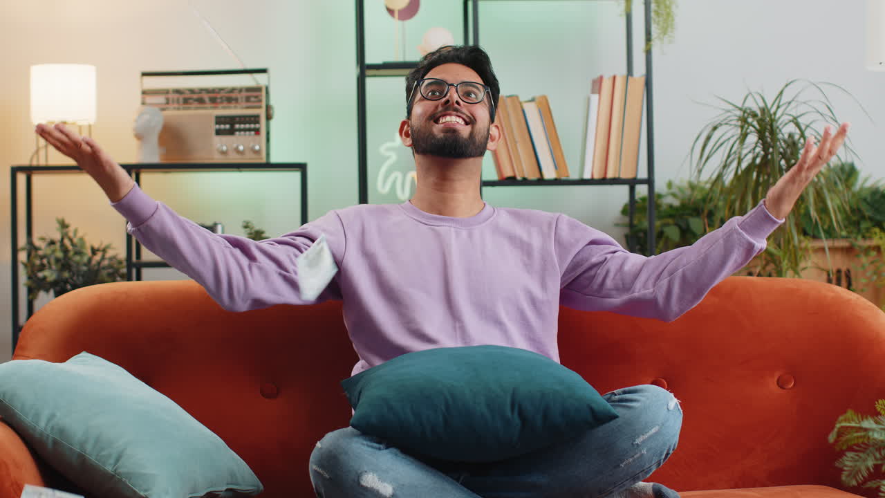 Money cash dollar rain falling on guy celebrating success winning good news lottery jackpot luck