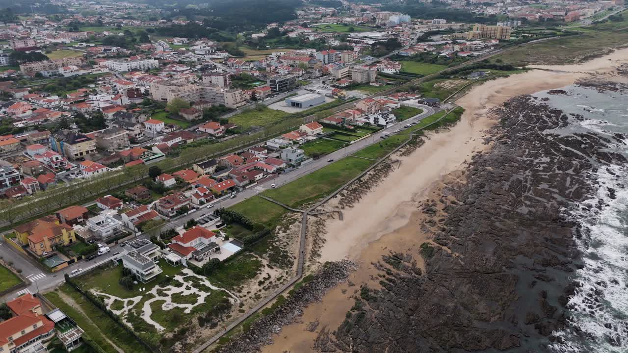 wide aerial view of gaia portugal coastline with beach town and rocky atlantic shore