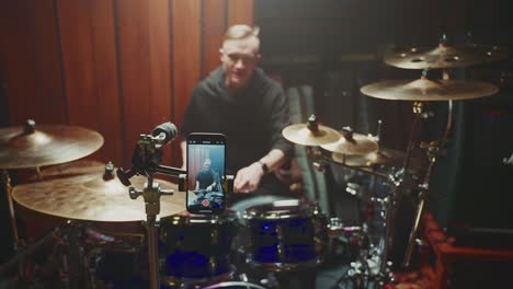 drummer recording a drum solo in a studio