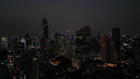Bangkok's-modern-and-impressive-skyline-like-never-before,-with-stunning-drone-footage-of-the-Sathorn-CBD-at-night