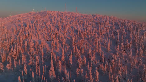 aerial view rising toward the top of thr sallatunturi fell, sunrise in finland