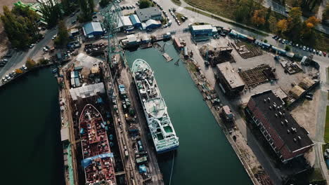 Drone-flying-above-cargo-ships-in-shipyard-docks