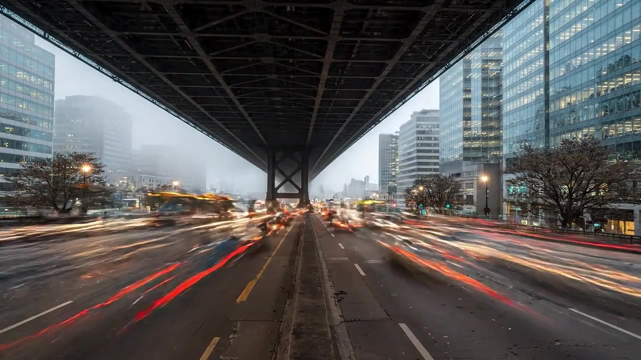 A Beautiful Cityscape Transition: Foggy Morning to Vibrant Sunset Over a Bridge, Showcasing the Dynamic Life of an Urban Environment