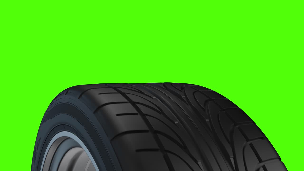 Loop spinning car wheel on a green background | Premium Stock Video Footage